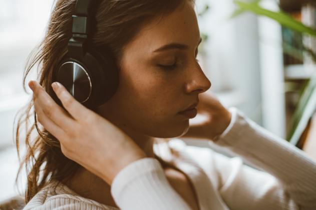 woman listening on headphones